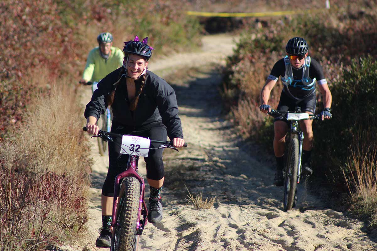 Bikers racing on sand road